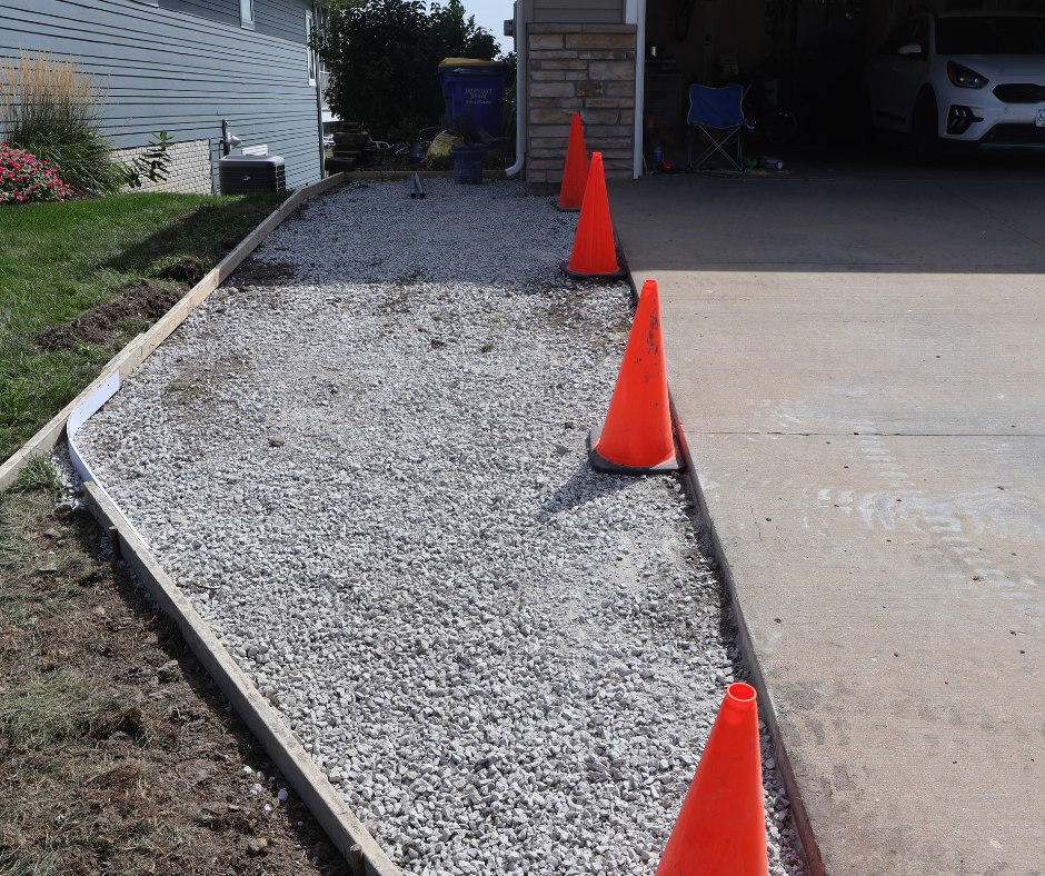 Before concrete driveway and pad installation in North Liberty, Iowa